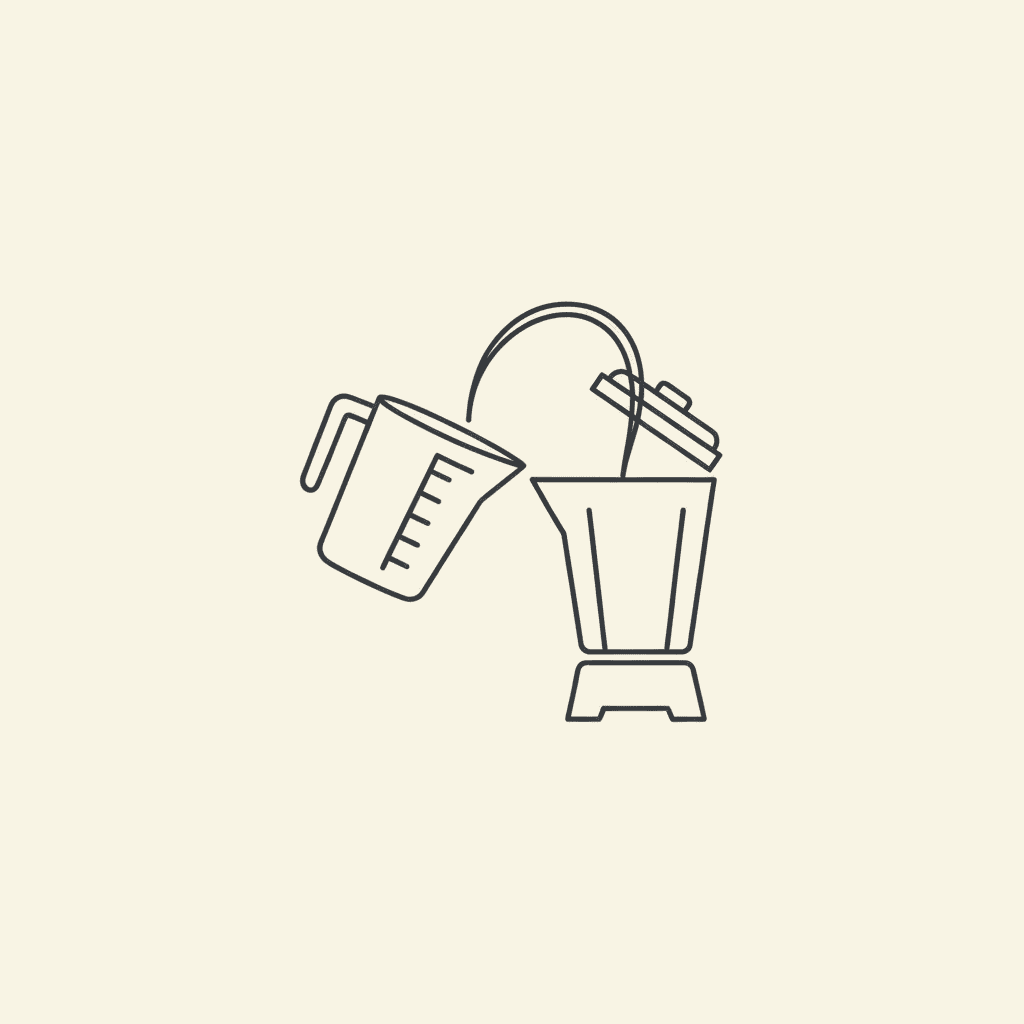 Add the Juice: a liquid measuring cup pouring apple juice into a blender pitcher