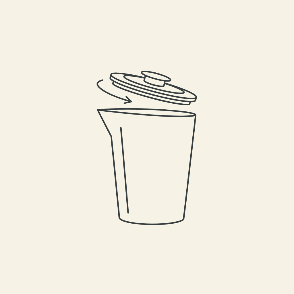 Secure the Lid: a blender lid being twisted onto a pitcher