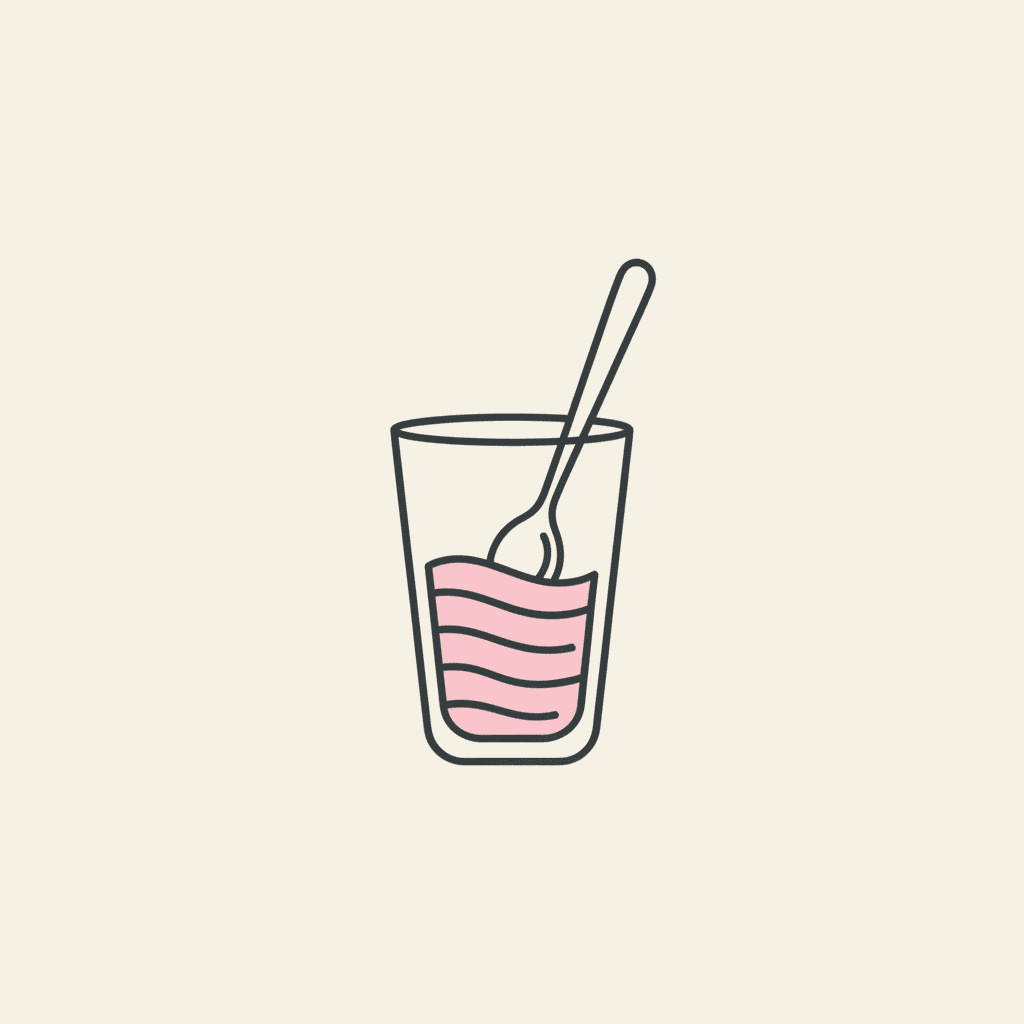 Stir Gently: a long spoon in a pink drink