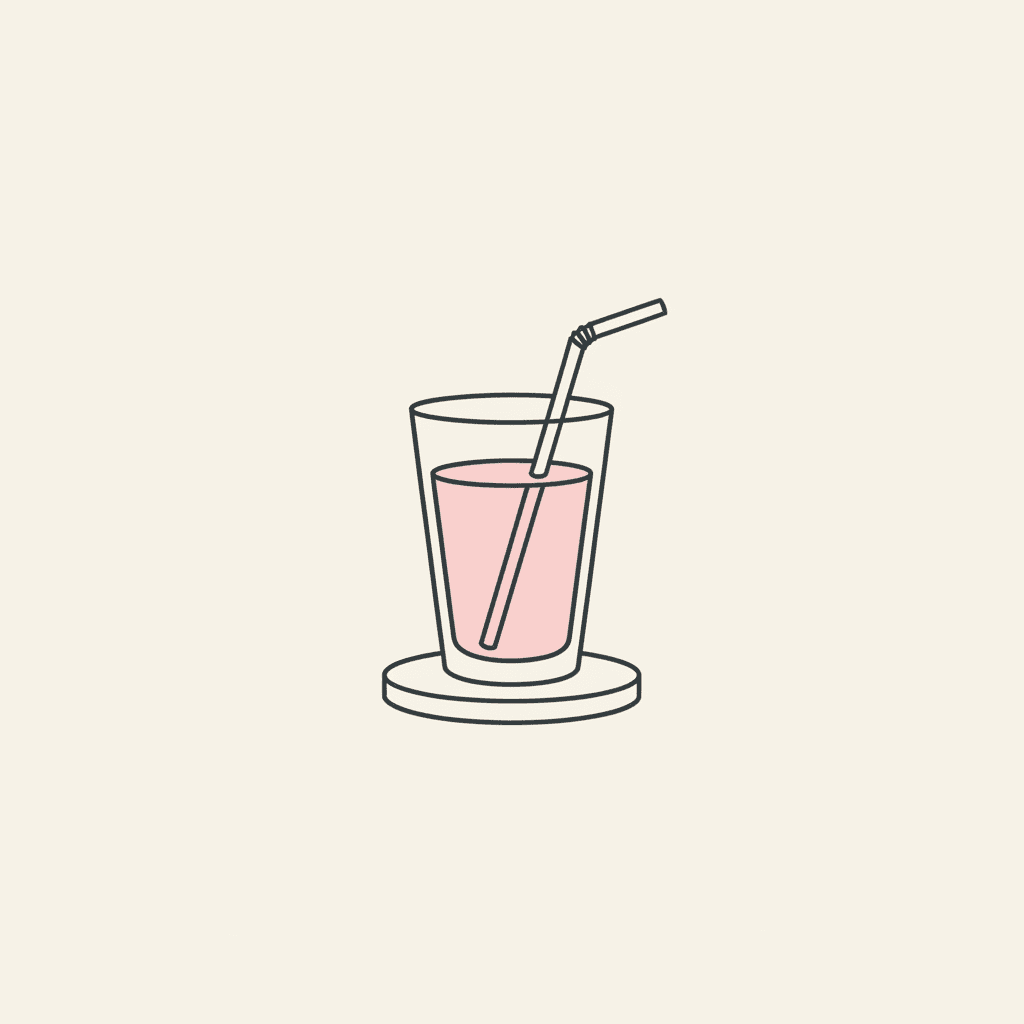 Serve Immediately: a finished pink drink with a straw on a coaster