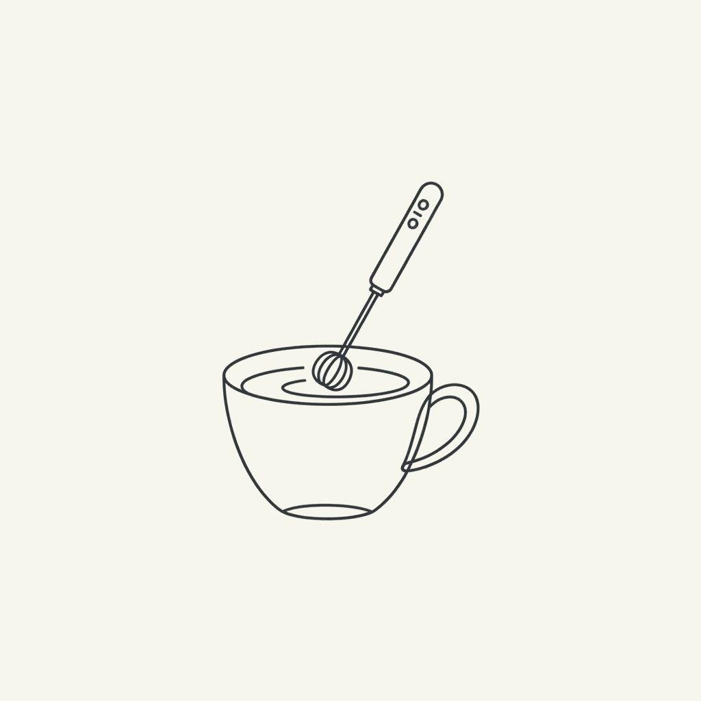 Froth the Mixture: a handheld milk frother in a cup