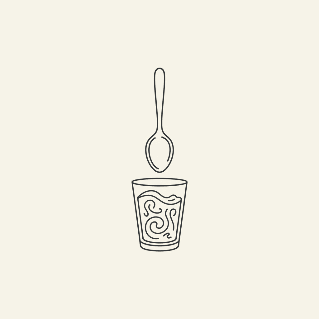 Position the Spoon: an upside-down spoon hovering over a glass of orange puree