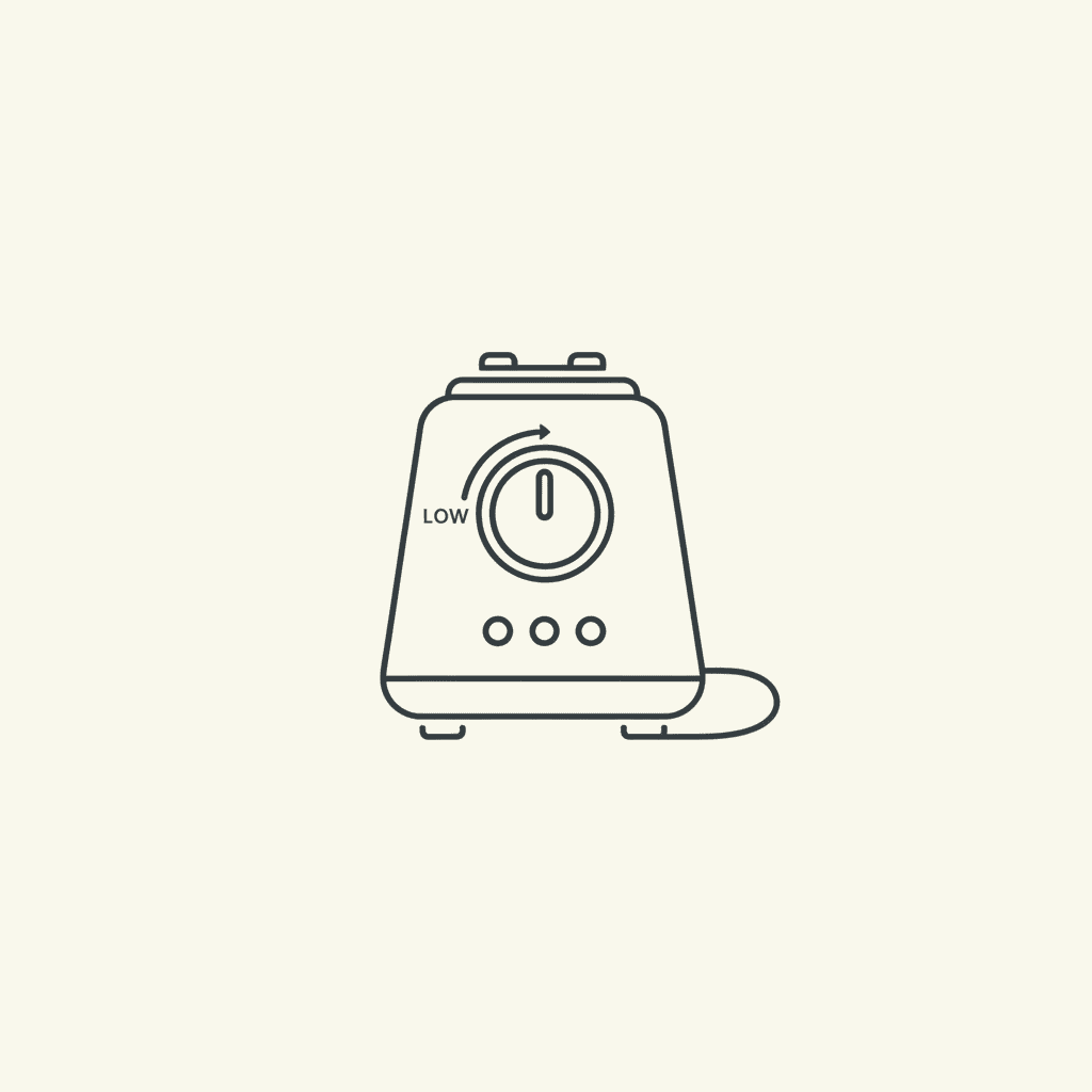 Start Blender Low: a blender base with the speed dial on low